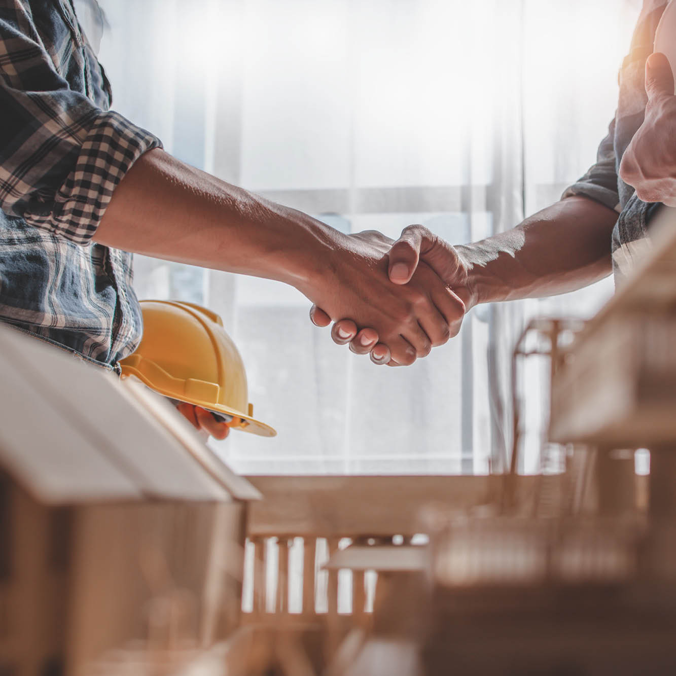 construction workers shaking hands
