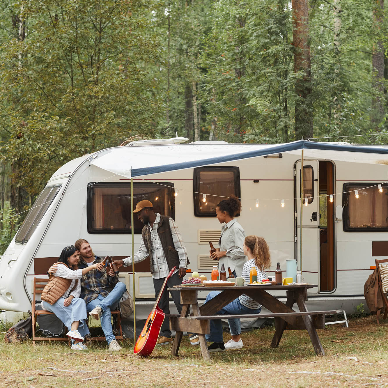 group of people camping in an RV