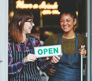 business partners with an open sign