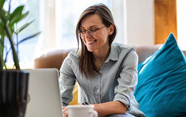 woman with glasses and laptop