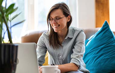 woman with glasses and laptop