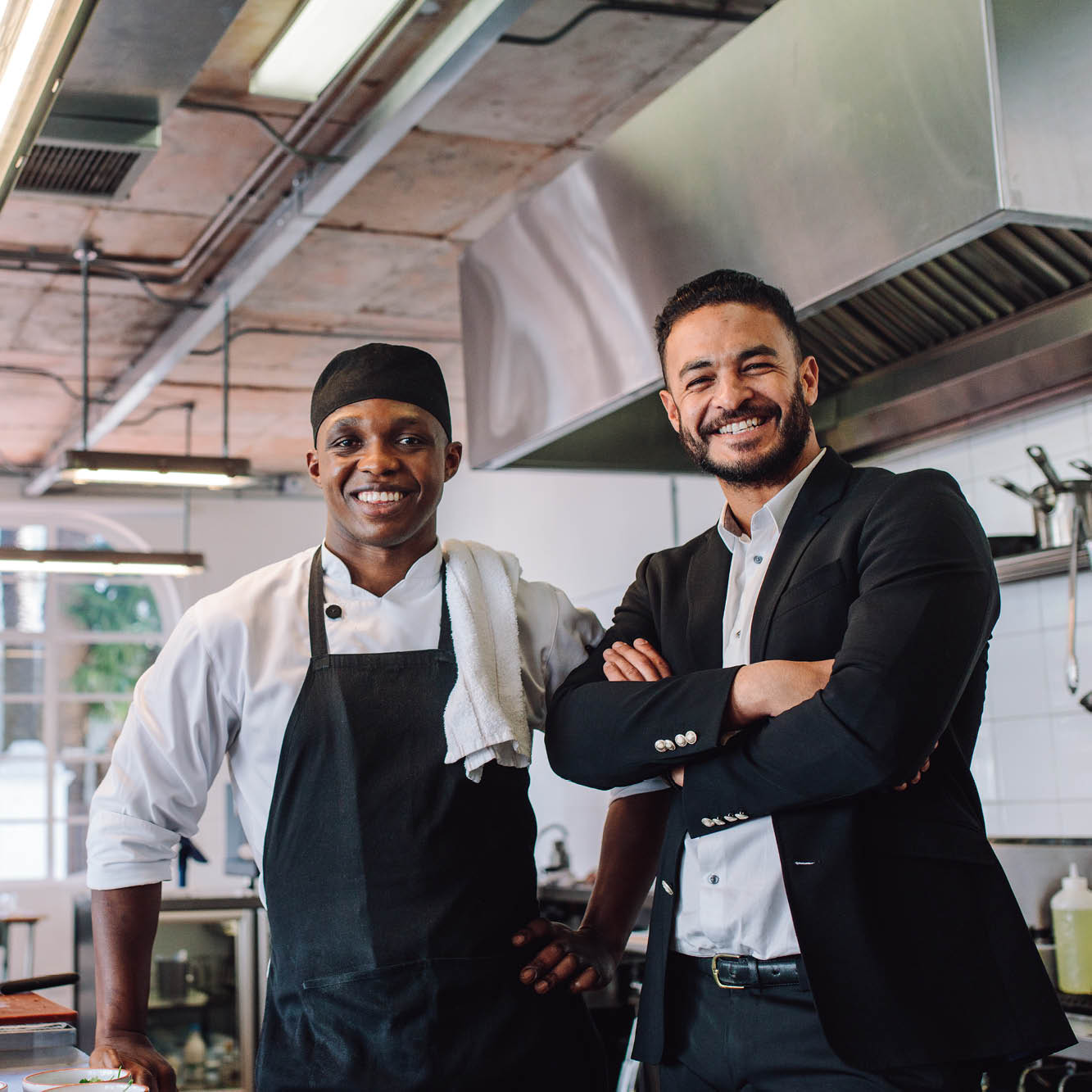 chef and restaurant owner in kitchen