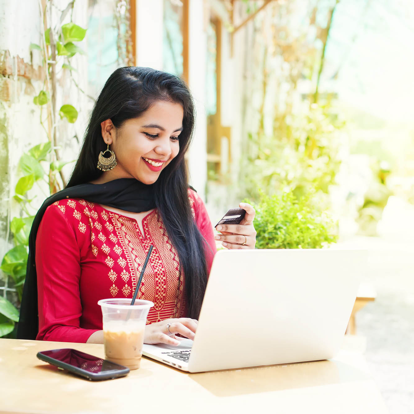 Girl putting card # into computer